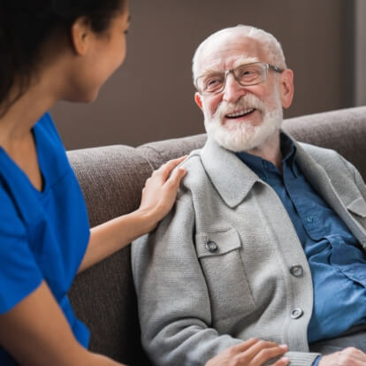 Nurse talking to elderly man