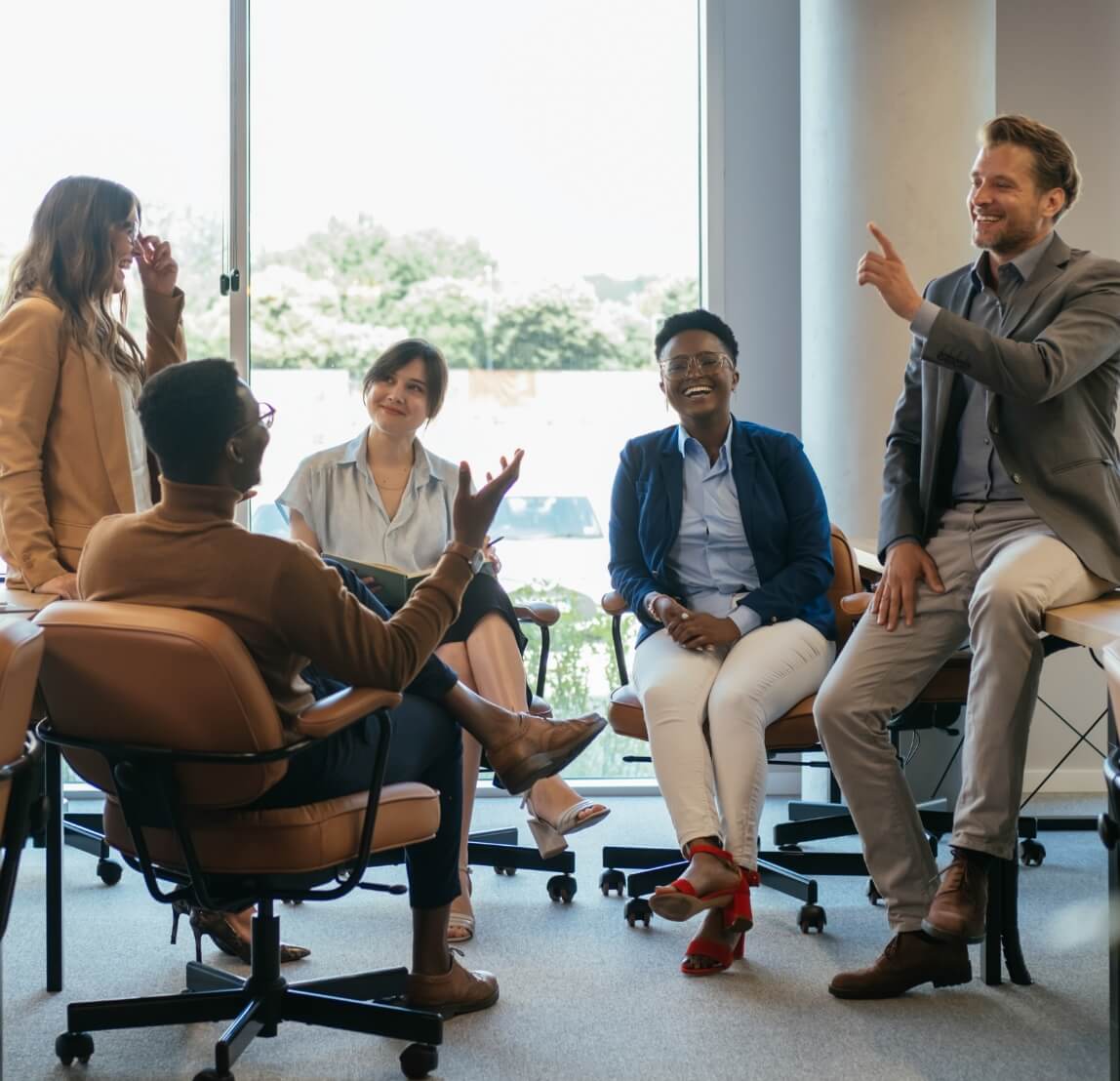 People laughing in a buisness meeting